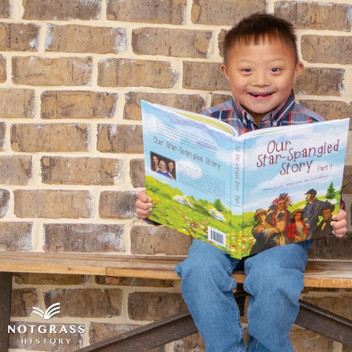 Child holding Notgrass History book